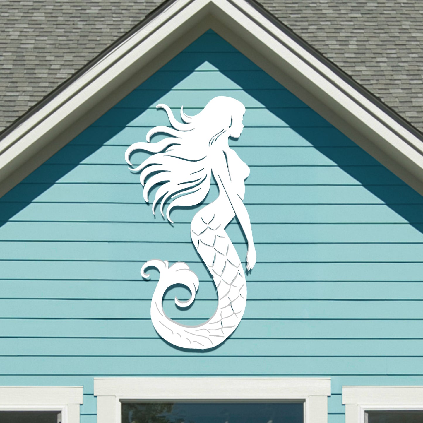 Mermaid sign displayed on a beach house exterior, highlighting its fade-resistant finish and ocean-inspired design.